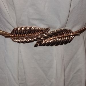 Vintage gold metal connecting leaves stretch belt.